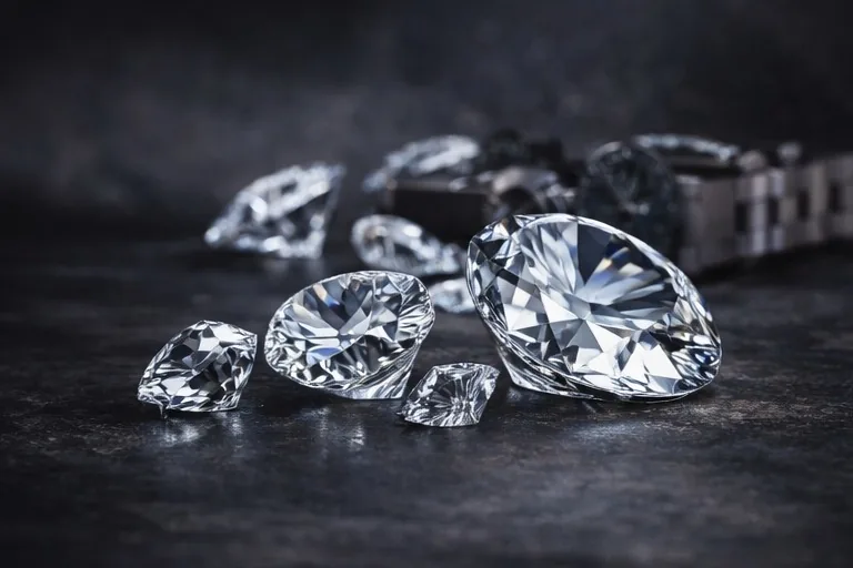 Loose diamonds on a dark surface